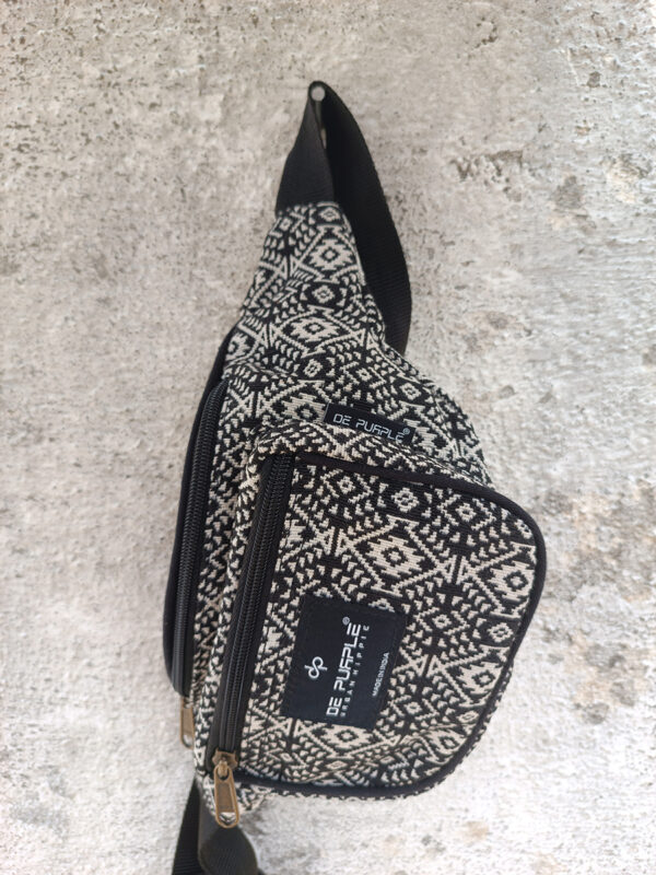 Black and beige aztec print unisex waist pouch with adjustable strap.