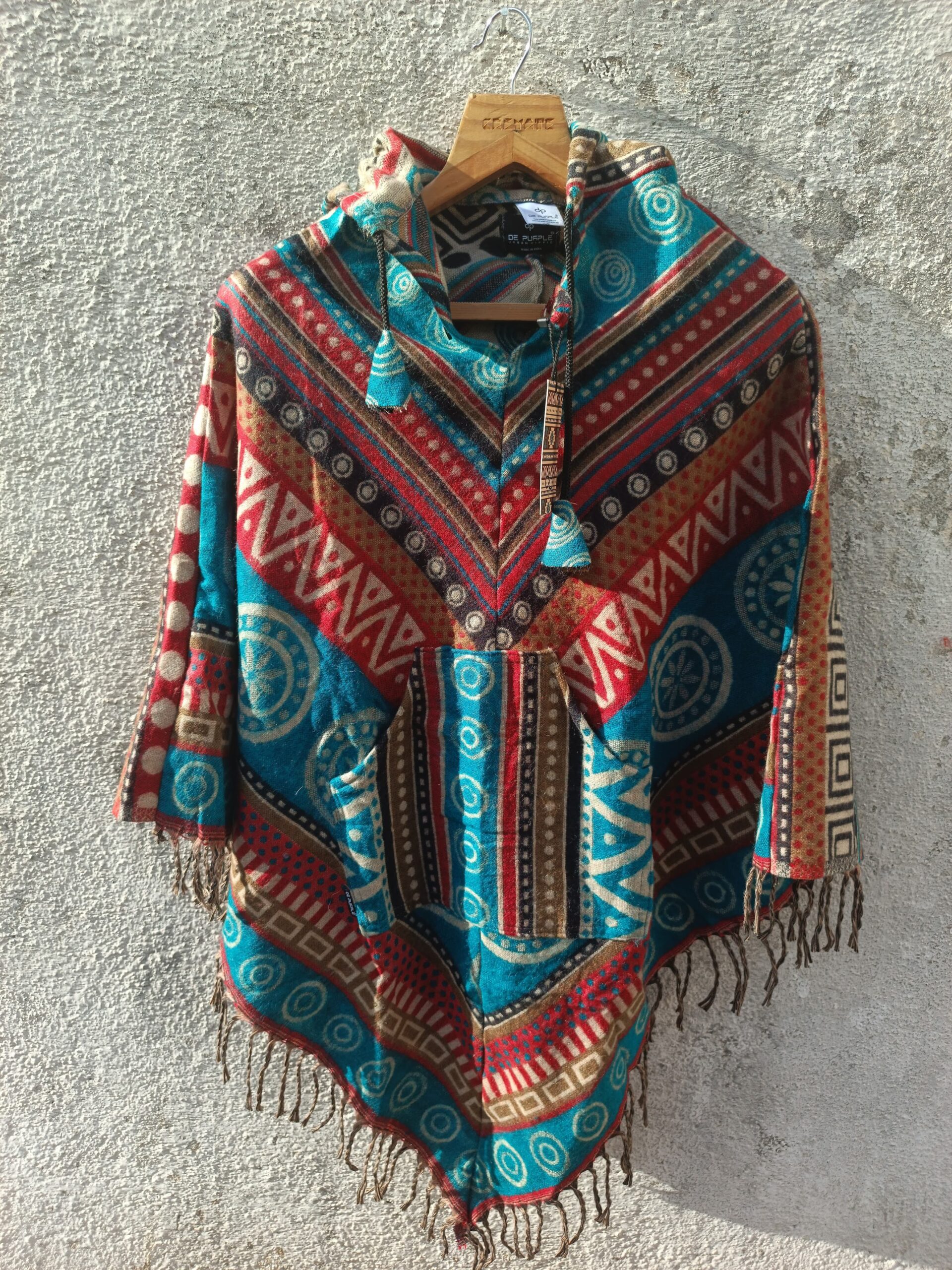 Multicolored printed Poncho with a drawstrring hoody,front pocket with a comfortable design our poncho is made from pure, soft, and breathable wool.