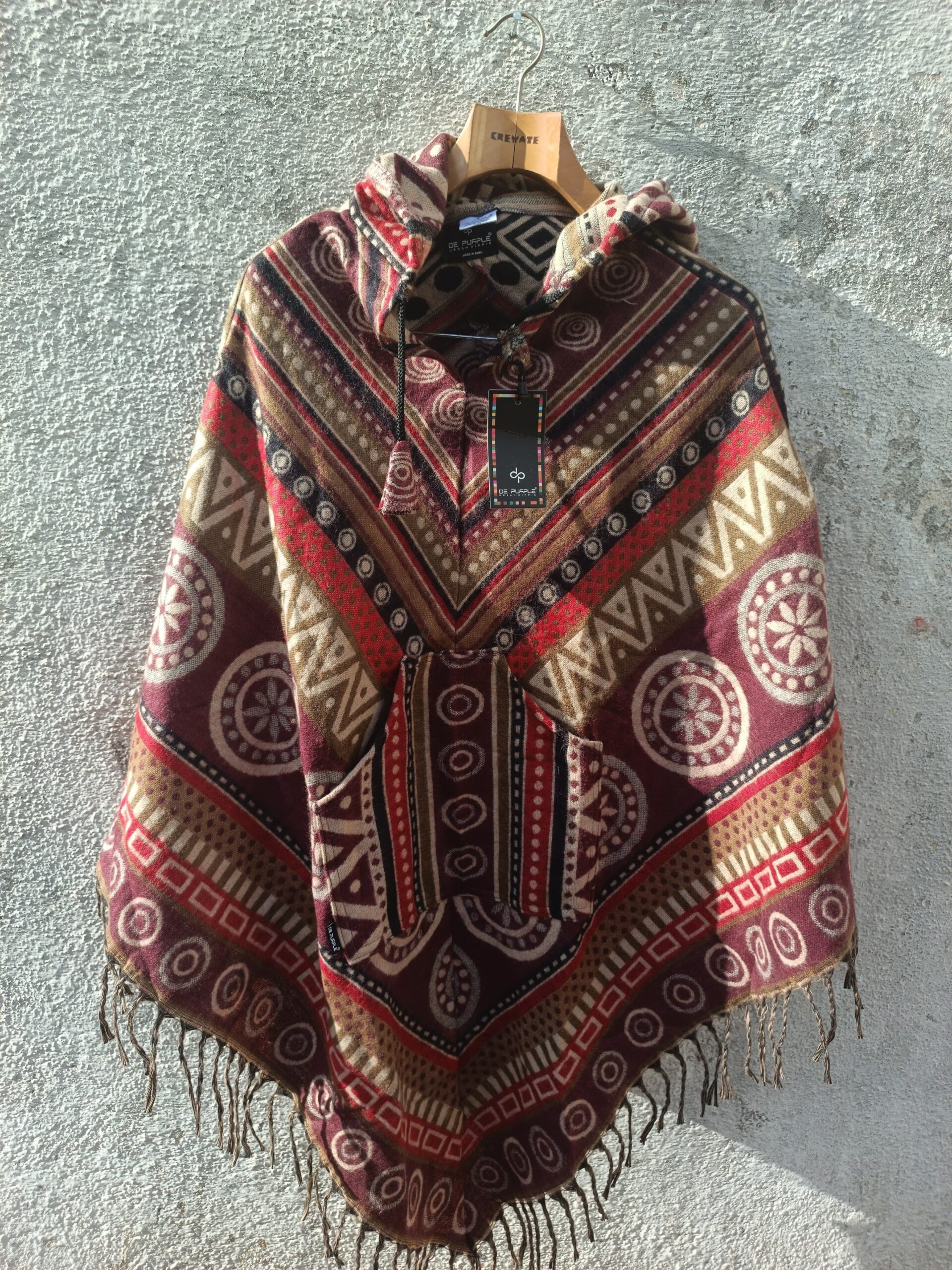 Multicolored printed Poncho with a drawstrring hoody,front pocket with a comfortable design our poncho is made from pure, soft, and breathable wool.