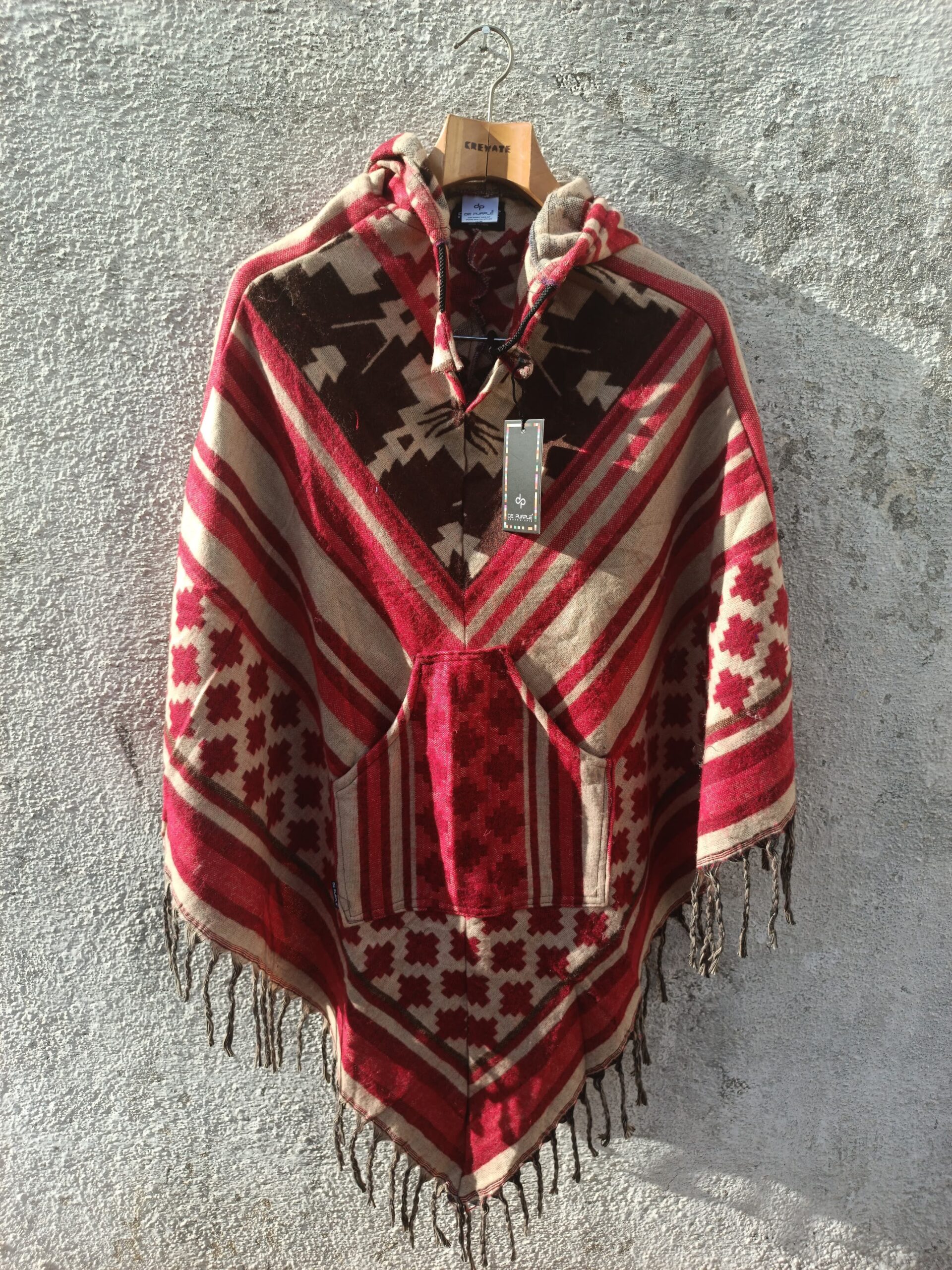 Multicolored printed Poncho with a drawstrring hoody,front pocket with a comfortable design our poncho is made from pure, soft, and breathable wool.